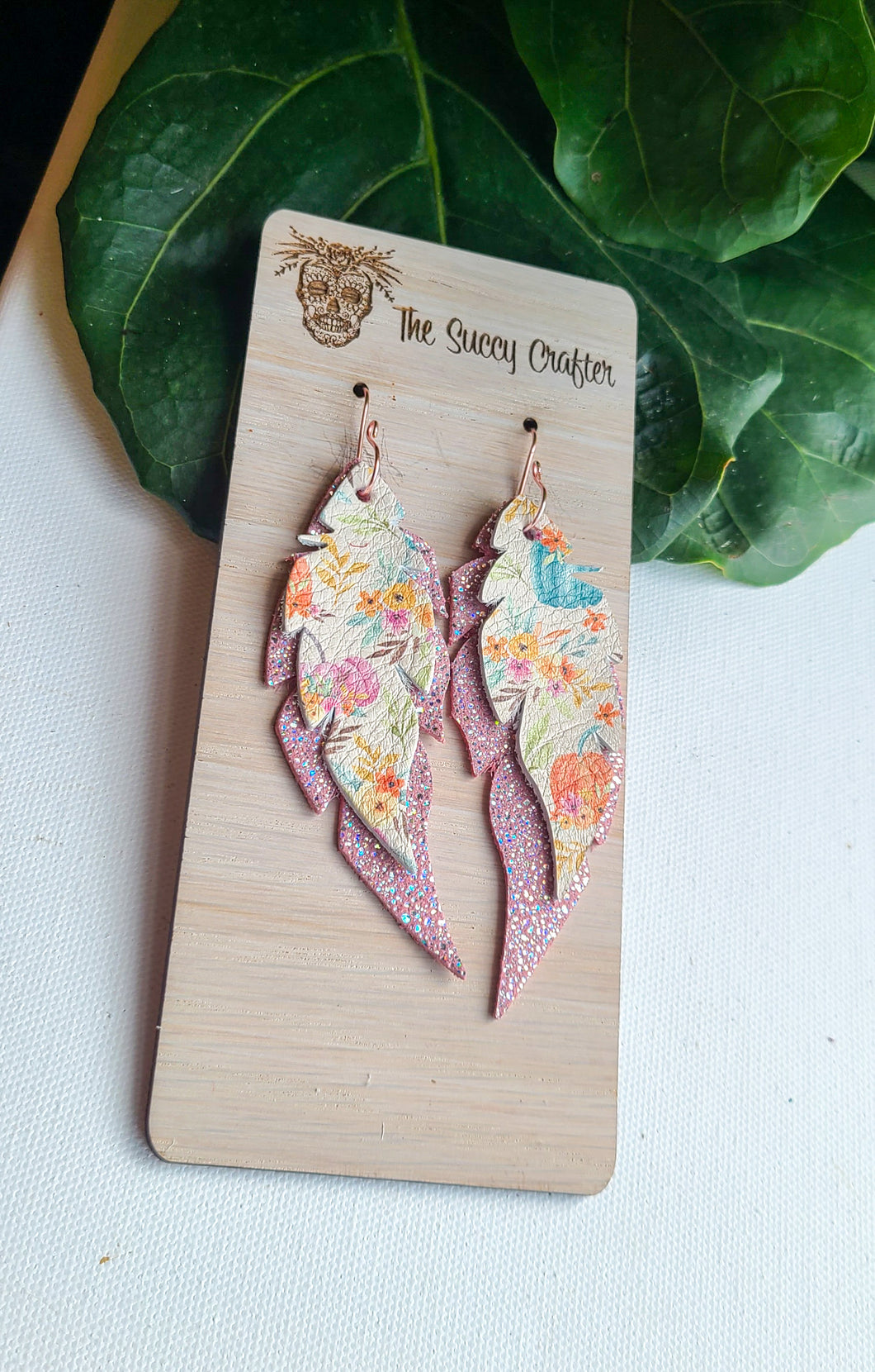 Feathers in boho pumpkins and pink sparkle