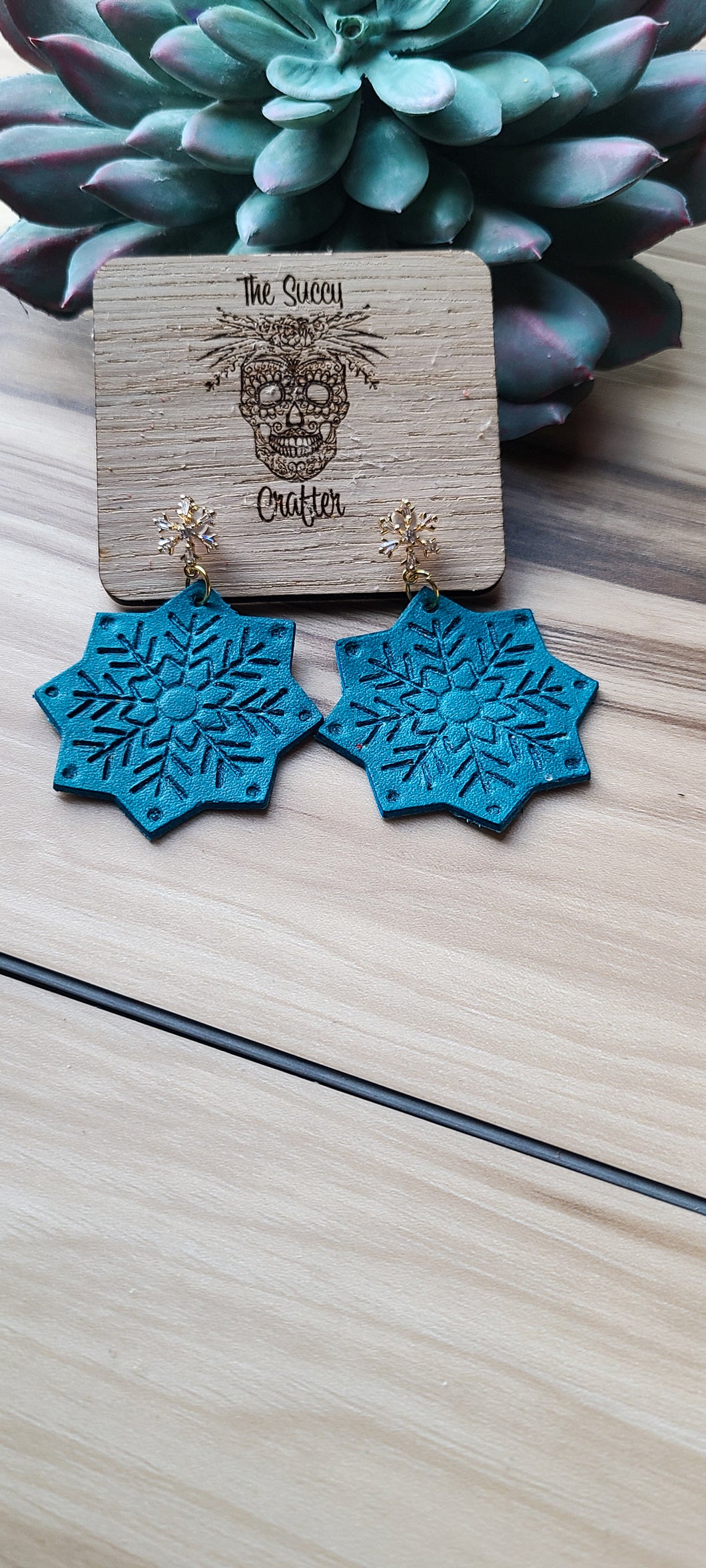 Turquoise embossed snowflakes