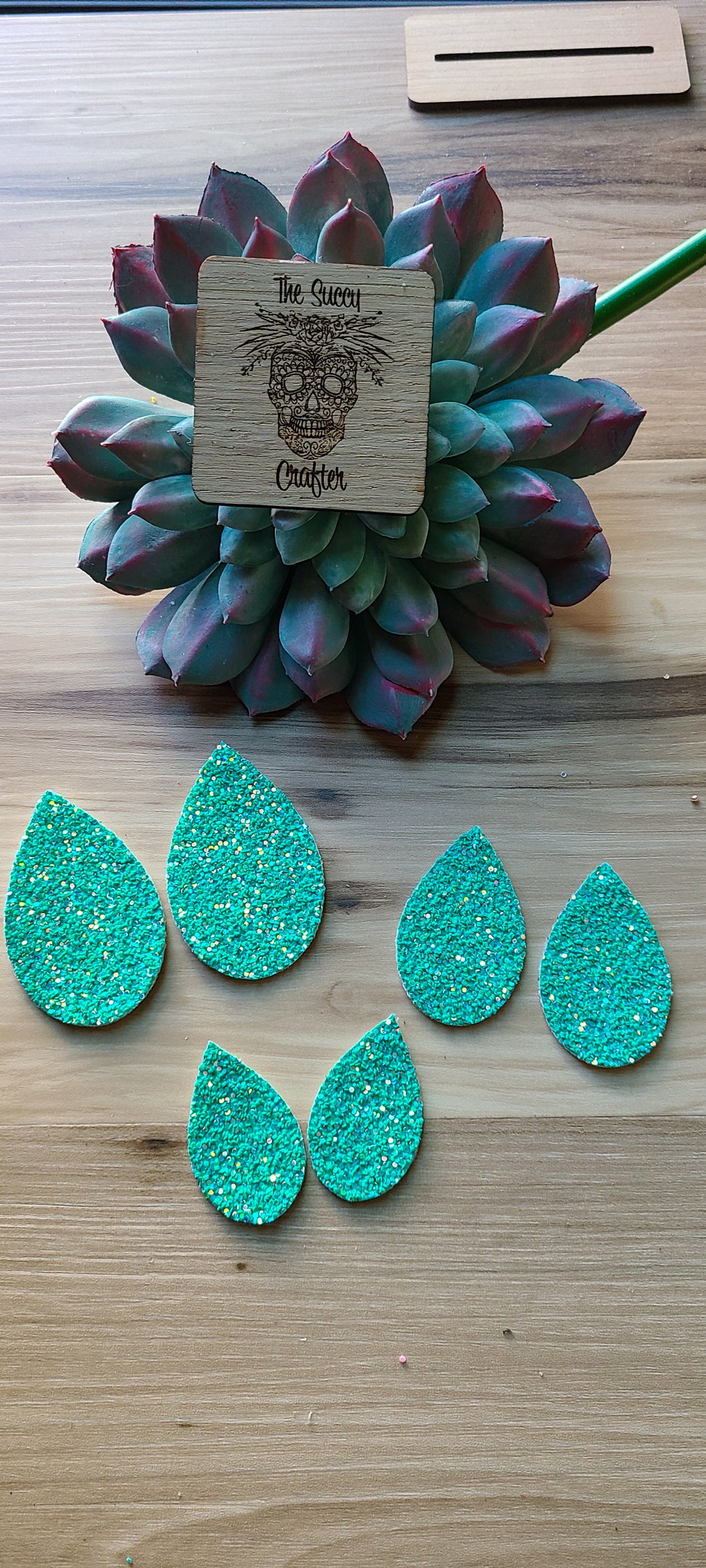 Bright turquoise glitter teardrop